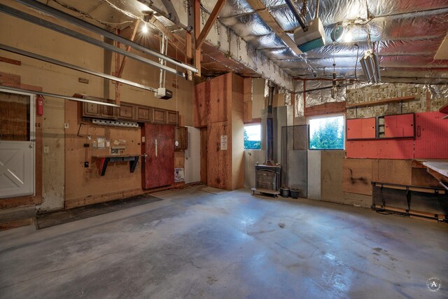 15 Vigilante Trl, Clancy, MT 59634 - garage featuring a garage door opener and a wood stove