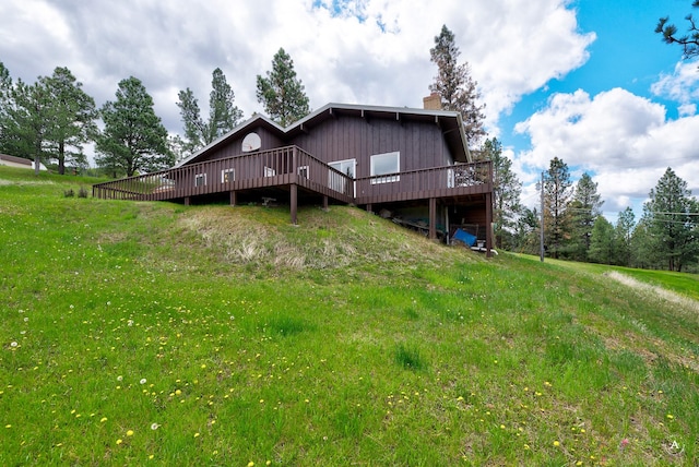 15 Vigilante Trl, Clancy, MT 59634 - back of property featuring a chimney and a wooden deck