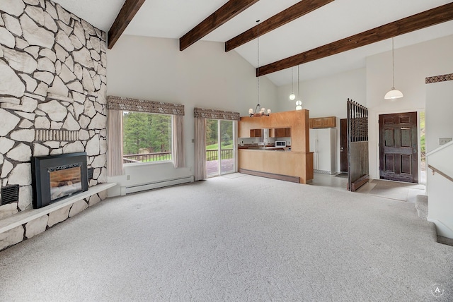 15 Vigilante Trl, Clancy, MT 59634 - unfurnished living room featuring a baseboard radiator, a chandelier, light colored carpet, high vaulted ceiling, and a fireplace