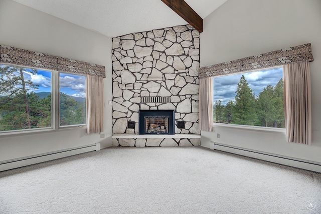15 Vigilante Trl, Clancy, MT 59634 - unfurnished living room featuring a baseboard heating unit, carpet floors, a stone fireplace, beamed ceiling, and high vaulted ceiling