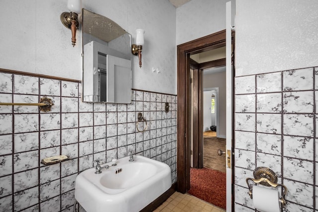 414 Somers Ave, Whitefish, MT 59937 - bathroom with tile walls and wainscoting