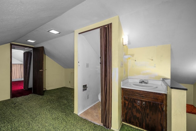 414 Somers Ave, Whitefish, MT 59937 - bathroom with toilet, vaulted ceiling, and vanity