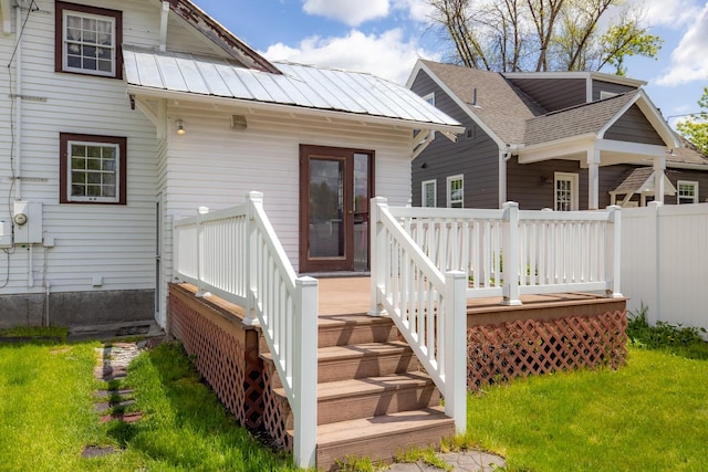 414 Somers Ave, Whitefish, MT 59937 - rear view of house featuring a deck, a yard, and metal roof