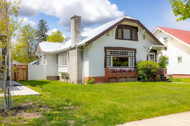 414 Somers Ave, Whitefish, MT 59937 - view of front of home with a chimney and metal roof