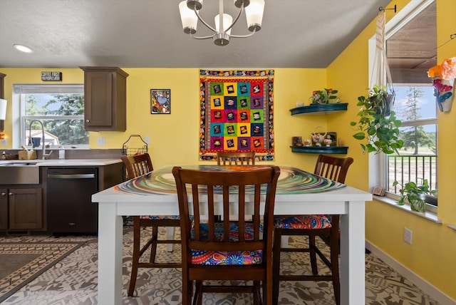 245 Blanchard Lake Rd, Whitefish, MT 59937 - dining space with a chandelier and baseboards