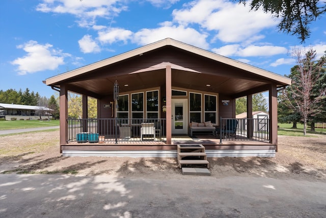 245 Blanchard Lake Rd, Whitefish, MT 59937 - rear view of property with a porch