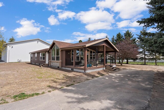 245 Blanchard Lake Rd, Whitefish, MT 59937 - view of front of home with a porch and asphalt driveway