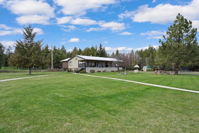 245 Blanchard Lake Rd, Whitefish, MT 59937 - view of front of home with a front yard and covered porch