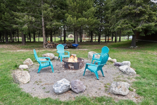 245 Blanchard Lake Rd, Whitefish, MT 59937 - view of green lawn featuring an outdoor fire pit