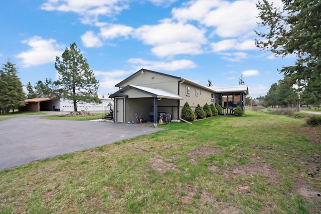 245 Blanchard Lake Rd, Whitefish, MT 59937 - view of side of property with a lawn