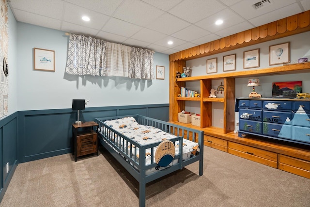 245 Blanchard Lake Rd, Whitefish, MT 59937 - carpeted bedroom with a paneled ceiling, a wainscoted wall, and recessed lighting
