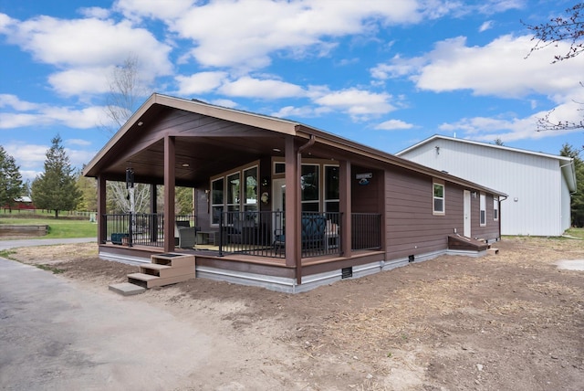245 Blanchard Lake Rd, Whitefish, MT 59937 - rear view of property featuring covered porch and crawl space