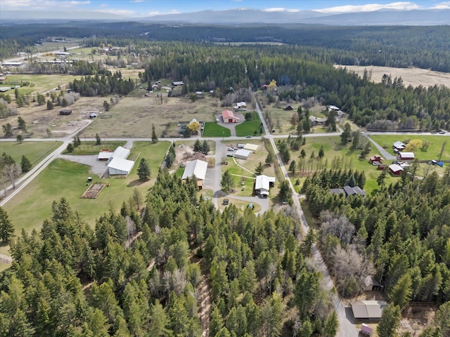 245 Blanchard Lake Rd, Whitefish, MT 59937 - aerial view of property and surrounding area with a heavily wooded area and a mountain backdrop