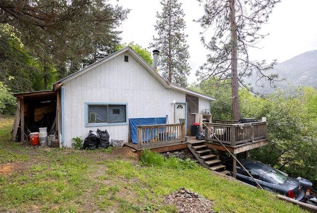 103 6th St, Alberton, MT 59820 - back of house featuring a deck with mountain view