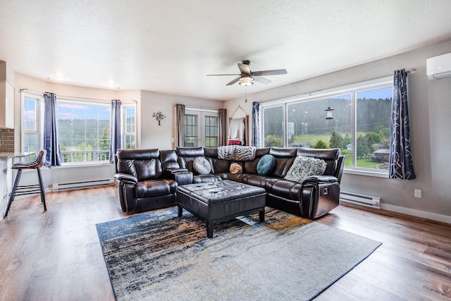 30 Knapp Ln, Kalispell, MT 59901 - living room with baseboard heating, ceiling fan, wood finished floors, and baseboards