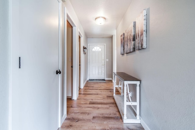 30 Knapp Ln, Kalispell, MT 59901 - doorway to outside with light wood finished floors and baseboards