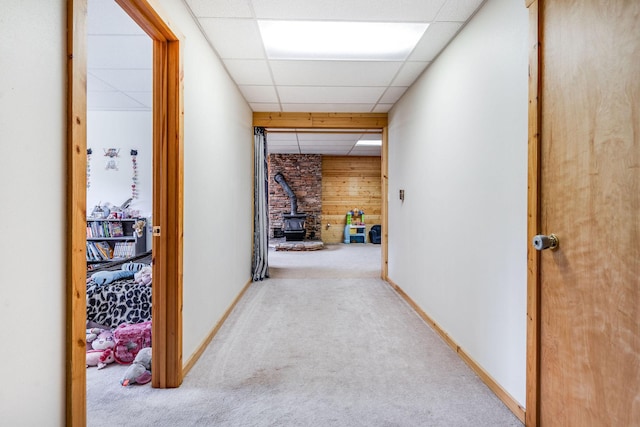30 Knapp Ln, Kalispell, MT 59901 - hallway with carpet floors, wooden walls, a drop ceiling, and baseboards