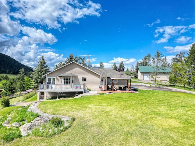 30 Knapp Ln, Kalispell, MT 59901 - back of property with a deck and a yard