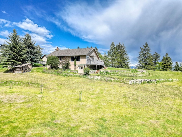 30 Knapp Ln, Kalispell, MT 59901 - view of green lawn with a deck