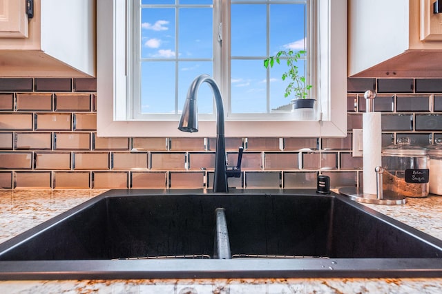 30 Knapp Ln, Kalispell, MT 59901 - kitchen view of a sink, backsplash, and light stone counters