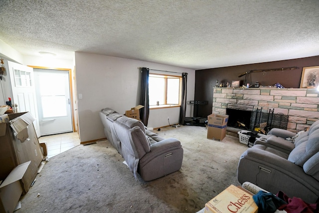 312 12th Ave N, Shelby, MT 59474 - living room with a stone fireplace, a textured ceiling, and light carpet