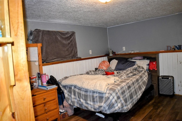 83 Indian Head Rd, Libby, MT 59923 - bedroom featuring wood finished floors and a textured ceiling