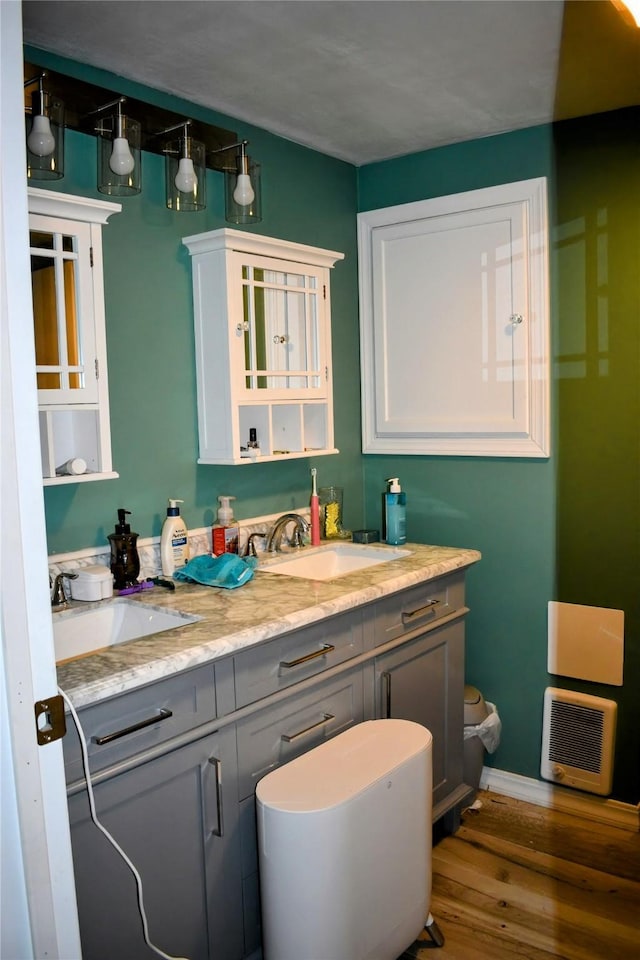 83 Indian Head Rd, Libby, MT 59923 - bathroom with double vanity, wood finished floors, and baseboards