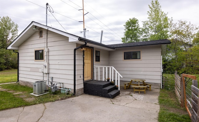 215 Tower St, Missoula, MT 59804 - back of house featuring central AC unit and a patio area