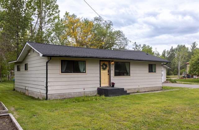 215 Tower St, Missoula, MT 59804 - view of front of home with a front lawn and a shingled roof