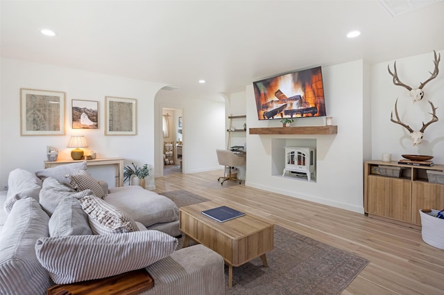 215 Tower St, Missoula, MT 59804 - living room with light wood-style flooring, arched walkways, baseboards, and recessed lighting