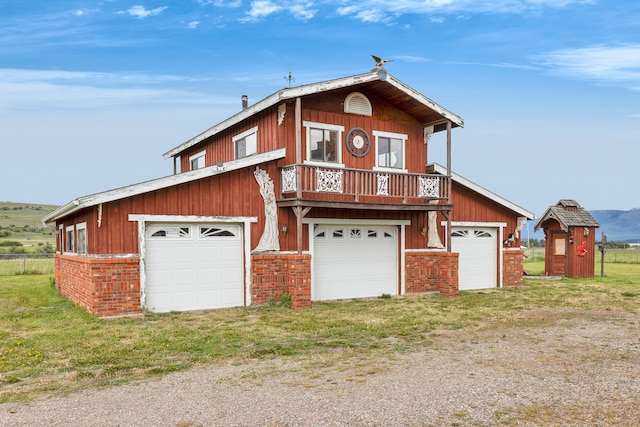 33562 Fox Rd, Polson, MT 59860 - view of front of house with a detached garage and brick siding
