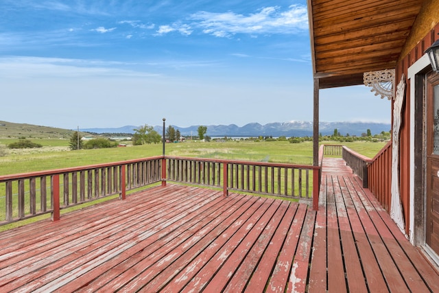 33562 Fox Rd, Polson, MT 59860 - wooden deck featuring a mountain view and a view of countryside