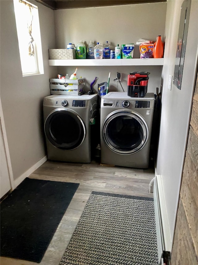 1008 4th Ave S, Great Falls, MT 59405 - washroom featuring washer and clothes dryer, electric panel, and wood finished floors