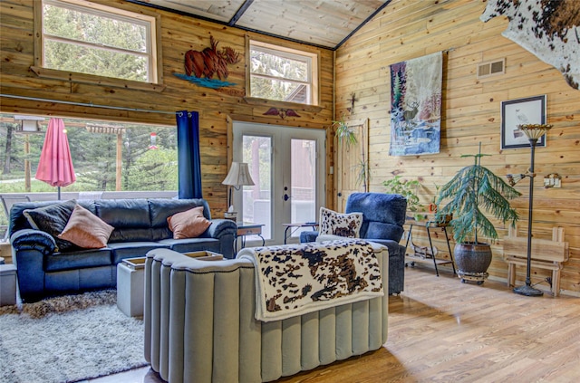 8229 York Rd, Helena, MT 59602 - living area featuring high vaulted ceiling, wood walls, wood finished floors, and wooden ceiling