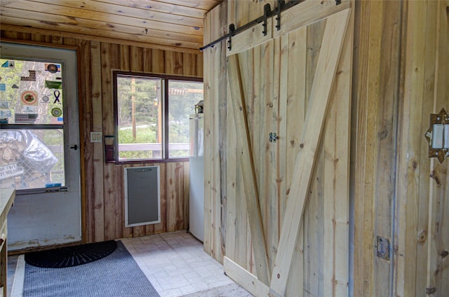 8229 York Rd, Helena, MT 59602 - doorway to outside with a barn door, wooden ceiling, and wood walls