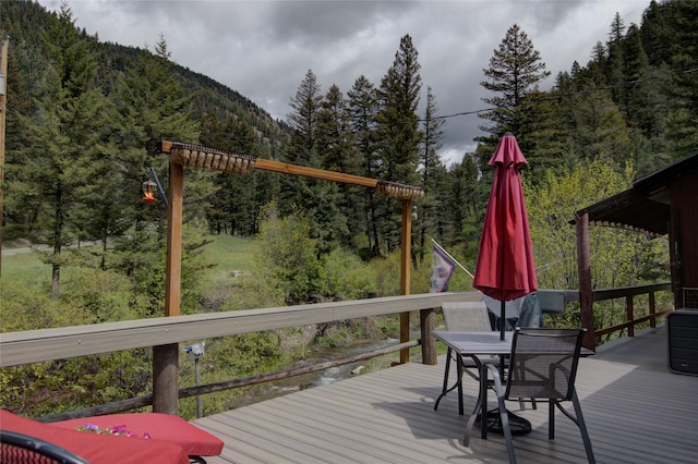 8229 York Rd, Helena, MT 59602 - deck with a view of trees, a mountain view, and outdoor dining area
