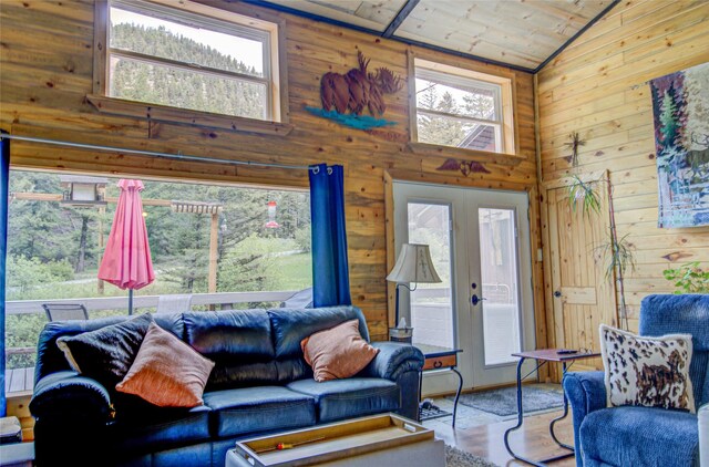 8229 York Rd, Helena, MT 59602 - living area featuring wood walls, wood ceiling, and high vaulted ceiling