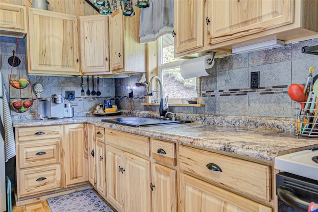 8229 York Rd, Helena, MT 59602 - kitchen featuring a sink, decorative backsplash, and light brown cabinets