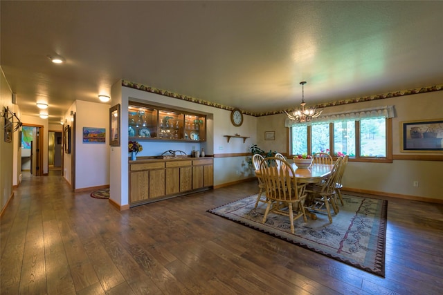 5380 US Highway 93, Conner, MT 59827 - dining space featuring a chandelier, dark wood-style flooring, and baseboards