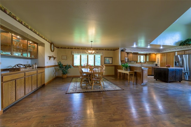 5380 US Highway 93, Conner, MT 59827 - dining area featuring dark wood-type flooring, a chandelier, and baseboards