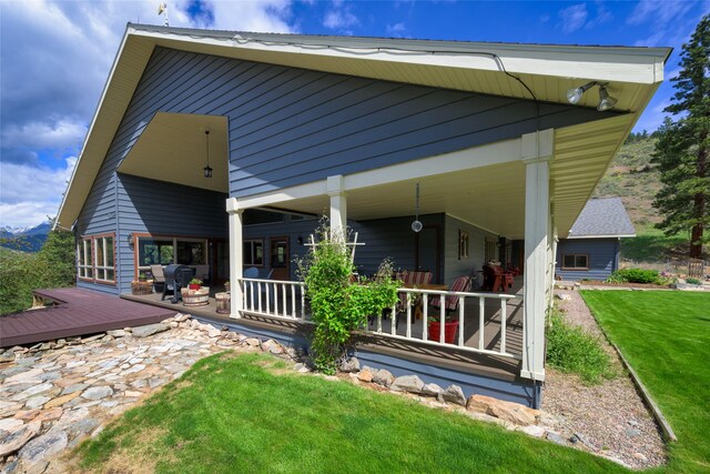 5380 US Highway 93, Conner, MT 59827 - rear view of house with a yard and covered porch