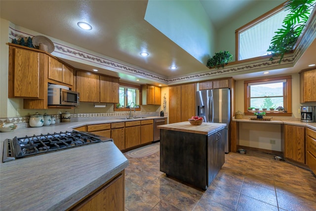 5380 US Highway 93, Conner, MT 59827 - kitchen featuring appliances with stainless steel finishes, butcher block counters, brown cabinetry, recessed lighting, and a center island