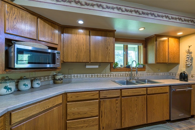 5380 US Highway 93, Conner, MT 59827 - kitchen with appliances with stainless steel finishes, a sink, brown cabinets, light countertops, and recessed lighting