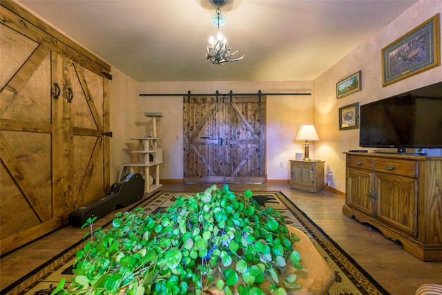 5380 US Highway 93, Conner, MT 59827 - living room featuring wood-type flooring, a barn door, and baseboards