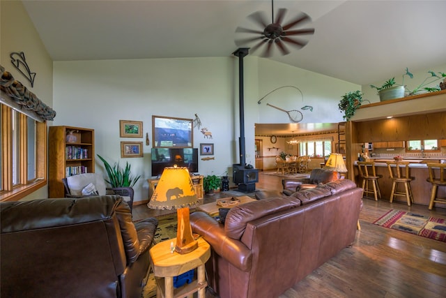 5380 US Highway 93, Conner, MT 59827 - living area featuring ceiling fan, a wood stove, high vaulted ceiling, and wood finished floors