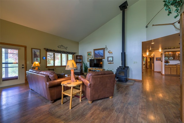 5380 US Highway 93, Conner, MT 59827 - living room featuring a wood stove, high vaulted ceiling, dark wood finished floors, and healthy amount of natural light