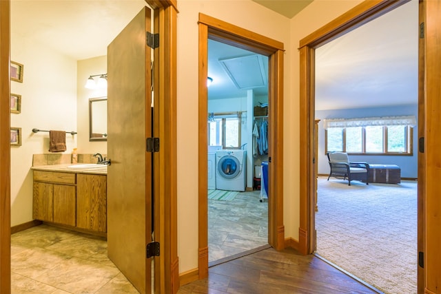 5380 US Highway 93, Conner, MT 59827 - hall featuring a sink, plenty of natural light, washing machine and dryer, and baseboards