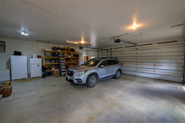 5380 US Highway 93, Conner, MT 59827 - garage featuring freestanding refrigerator and a garage door opener