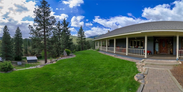 5380 US Highway 93, Conner, MT 59827 - view of grassy yard featuring covered porch and a mountain view