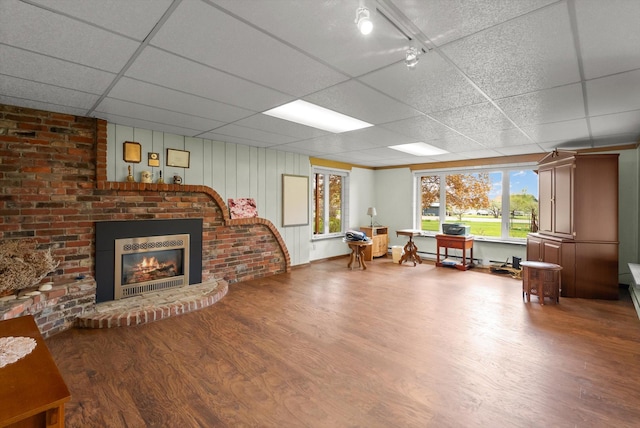 30 Panoramic Dr, Kalispell, MT 59901 - living area with a drop ceiling, wood finished floors, and a brick fireplace